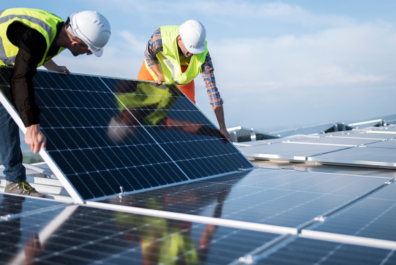 Men installing solar panels Men installing solar panels